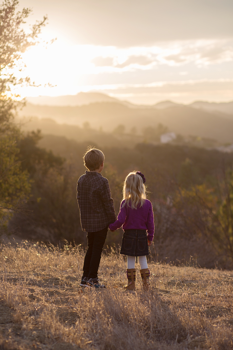 siblings at sunset